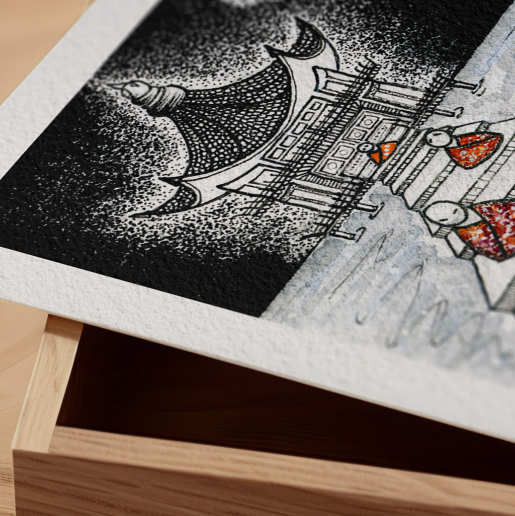 Detail of the Before the Bell fine art print resting on a wood surface, showing the deckle paper edge and close-up of the dotwork bell tower and moon in ink and watercolour