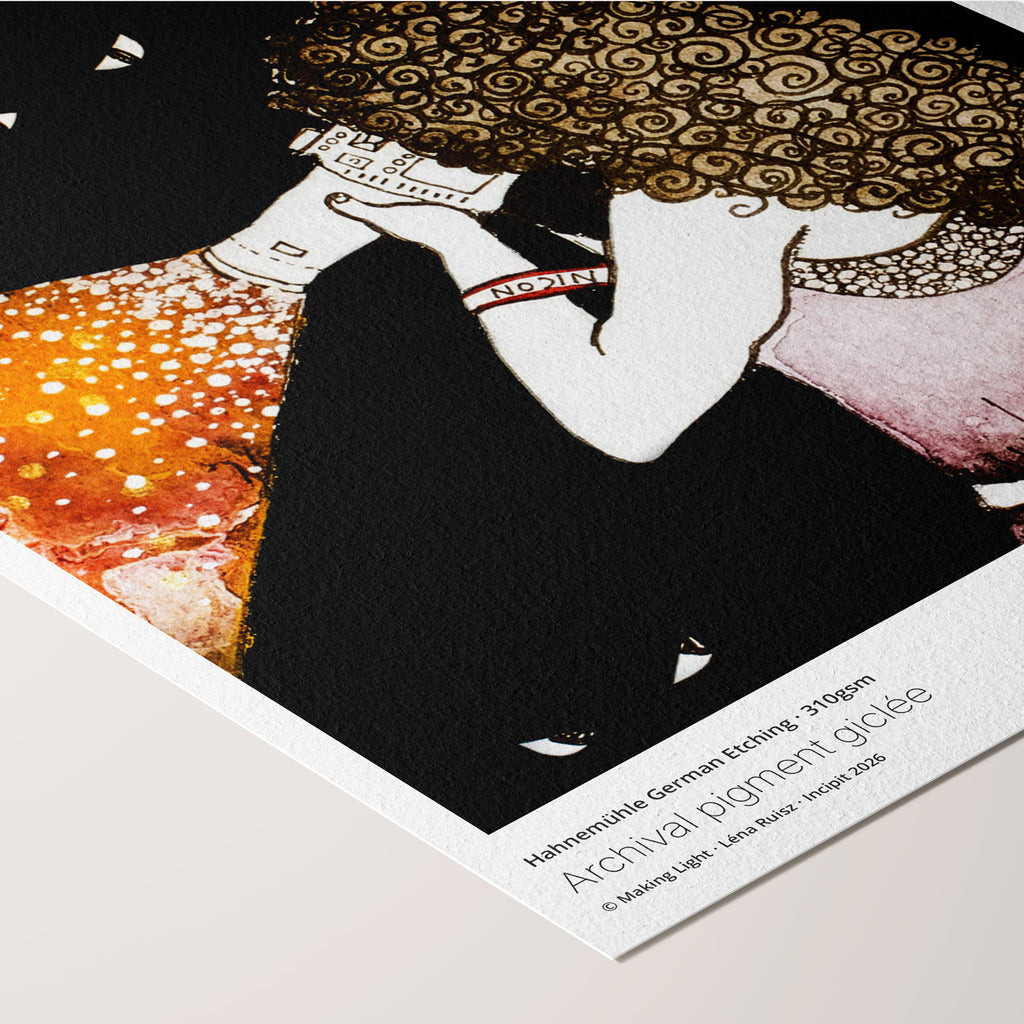 Corner of the Making Light fine art print on Hahnemühle German Etching paper, a woman with a camera casting a cone of golden light into darkness ringed by glowing eyes, angled with printed paper credentials.