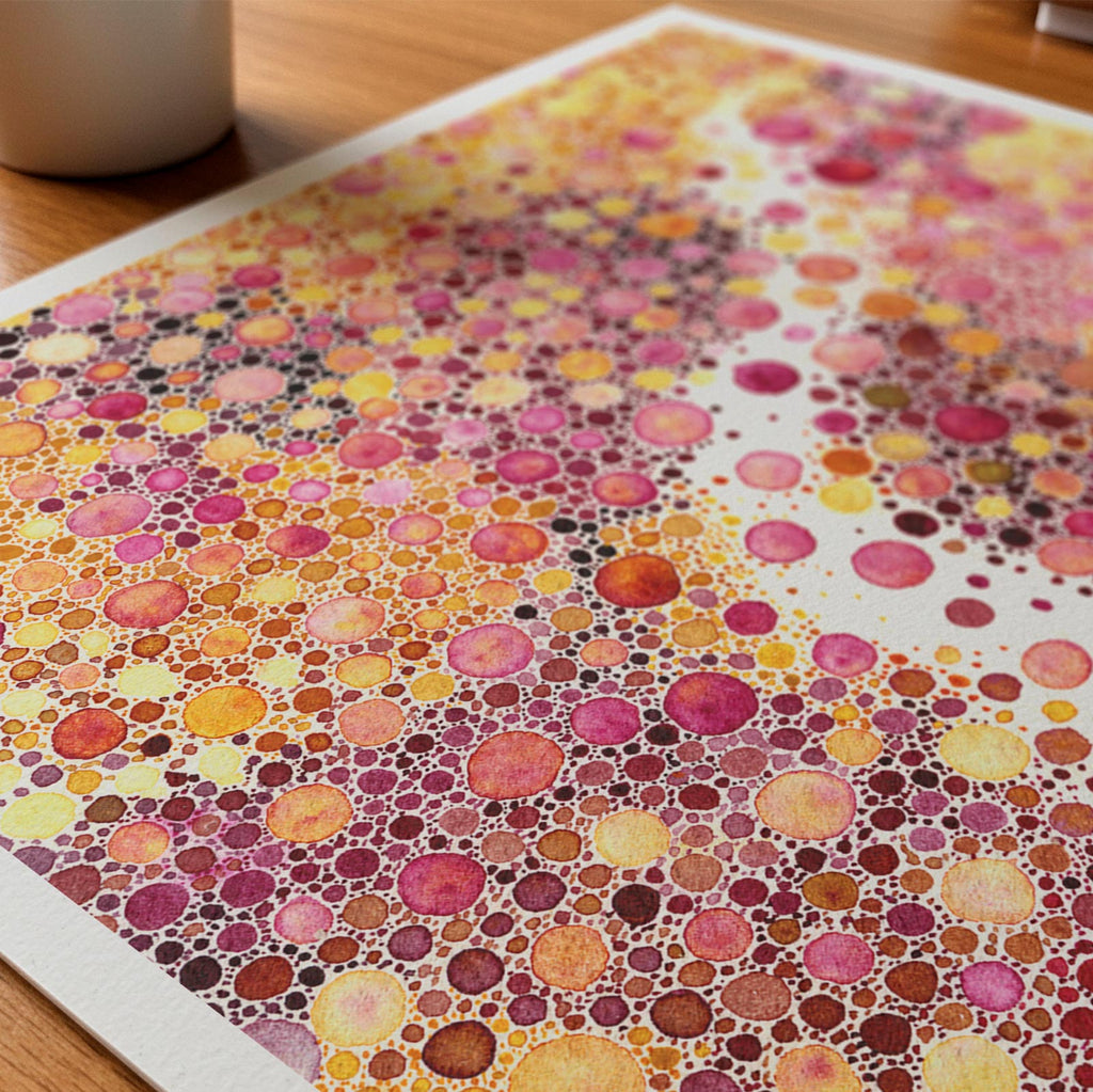 Close-up detail of the Prima Materia fine art print on textured Hahnemühle German Etching paper, a dense field of pink, gold and magenta watercolour dots parted by a winding channel of bare paper, by Léna Ruisz.