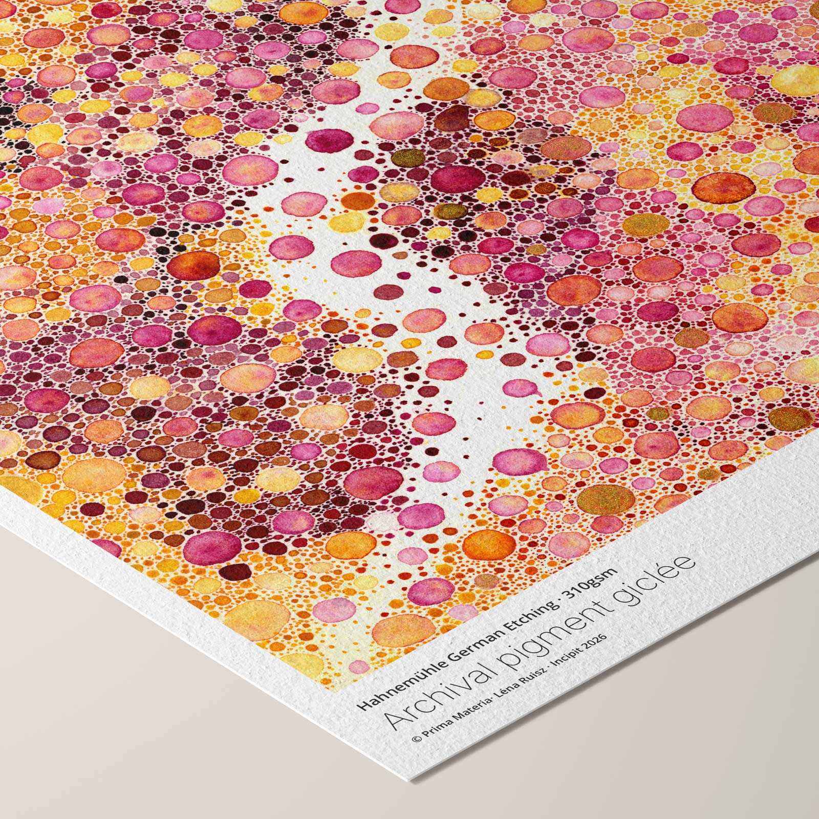 Angled corner of the Prima Materia fine art print on Hahnemühle German Etching paper, a dense abstract field of pink, gold and purple watercolour dots threaded by bare paper, with printed paper credentials.
