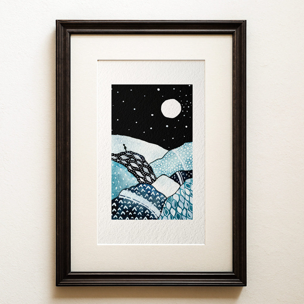 Watercolour and ink on black: a small figure on a cliff under a huge moon, the patterned landscape below in blues and silvers. The Watcher, a moonlit landscape fine art print.