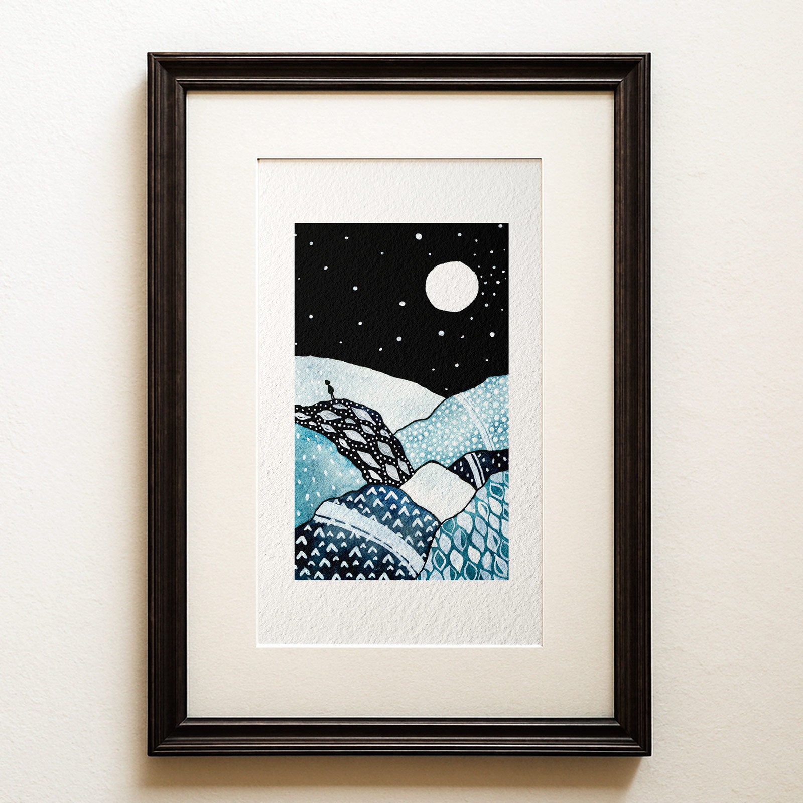 Watercolour and ink on black: a small figure on a cliff under a huge moon, the patterned landscape below in blues and silvers. The Watcher, a moonlit landscape fine art print.